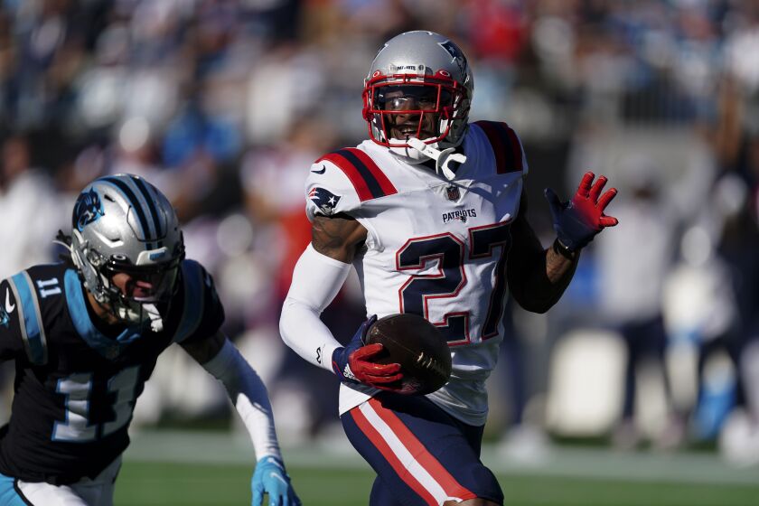 FILE - New England Patriots cornerback J.C. Jackson runs for a touchdown after an interception against the Carolina Panthers during the second half of an NFL football game Nov. 7, 2021, in Charlotte, N.C. New England opted against using the franchise tag on one of the top man-to-man cornerbacks in the league, leaving an attractive option for other teams. Jackson entered the league as an undrafted free agent in 2018 and leads the NFL with 25 interceptions since then. (AP Photo/John Bazemore, File)