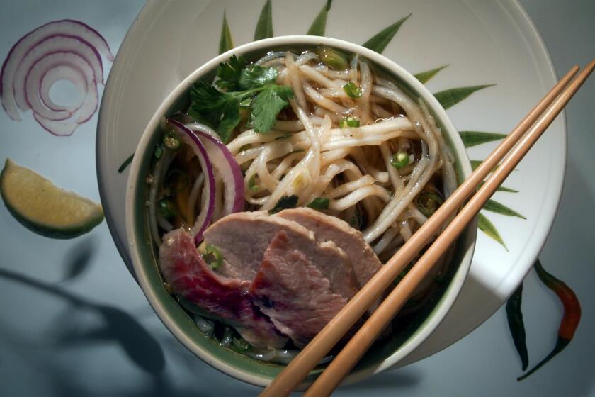 FO.Cover.Soup.0520.BC.studio -- Hue beef vermicelli soup photographed on 5/20/98. Bowl, plates and chopwsticks from Williams Sonoma, Pasadena.