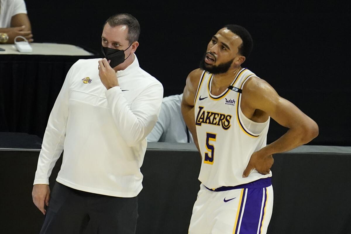Lakers coach Frank Vogel stands next to Lakers guard Talen Horton-Tucker.