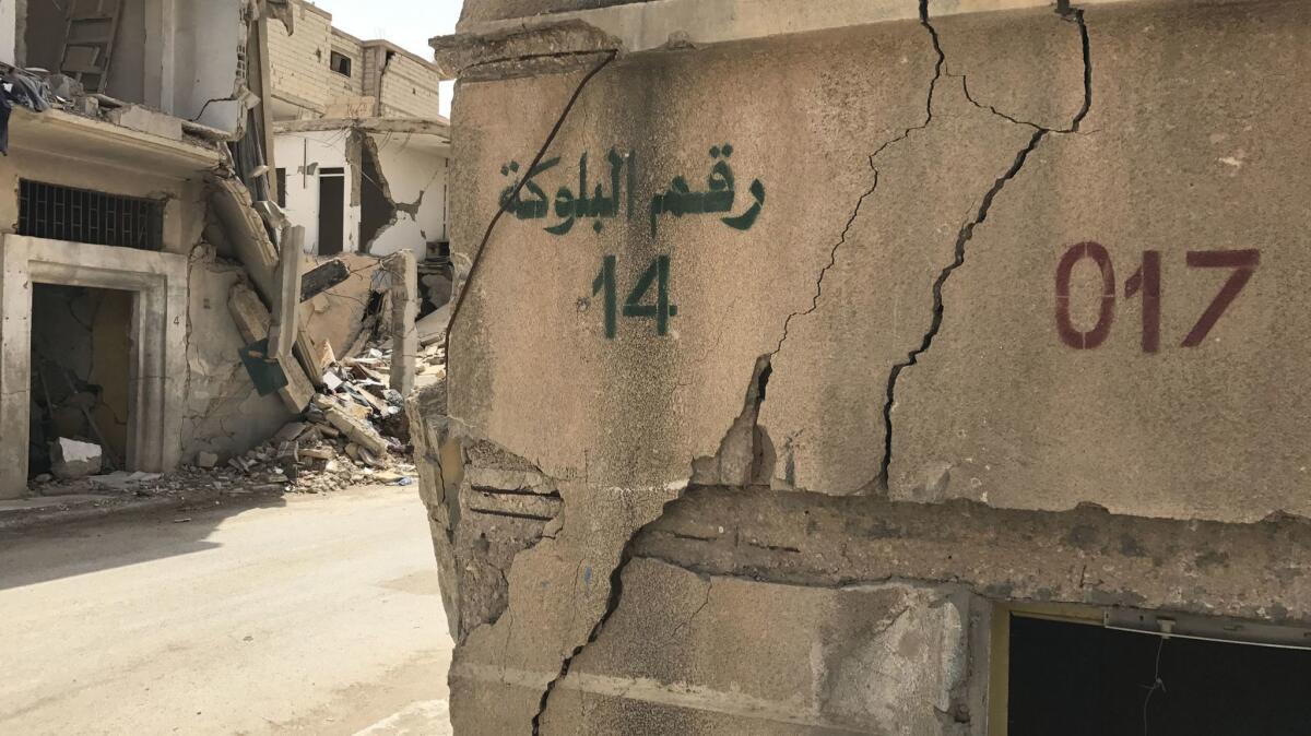 Islamic State stenciled new numbers on buildings and streets as it established a government over Palmyra.