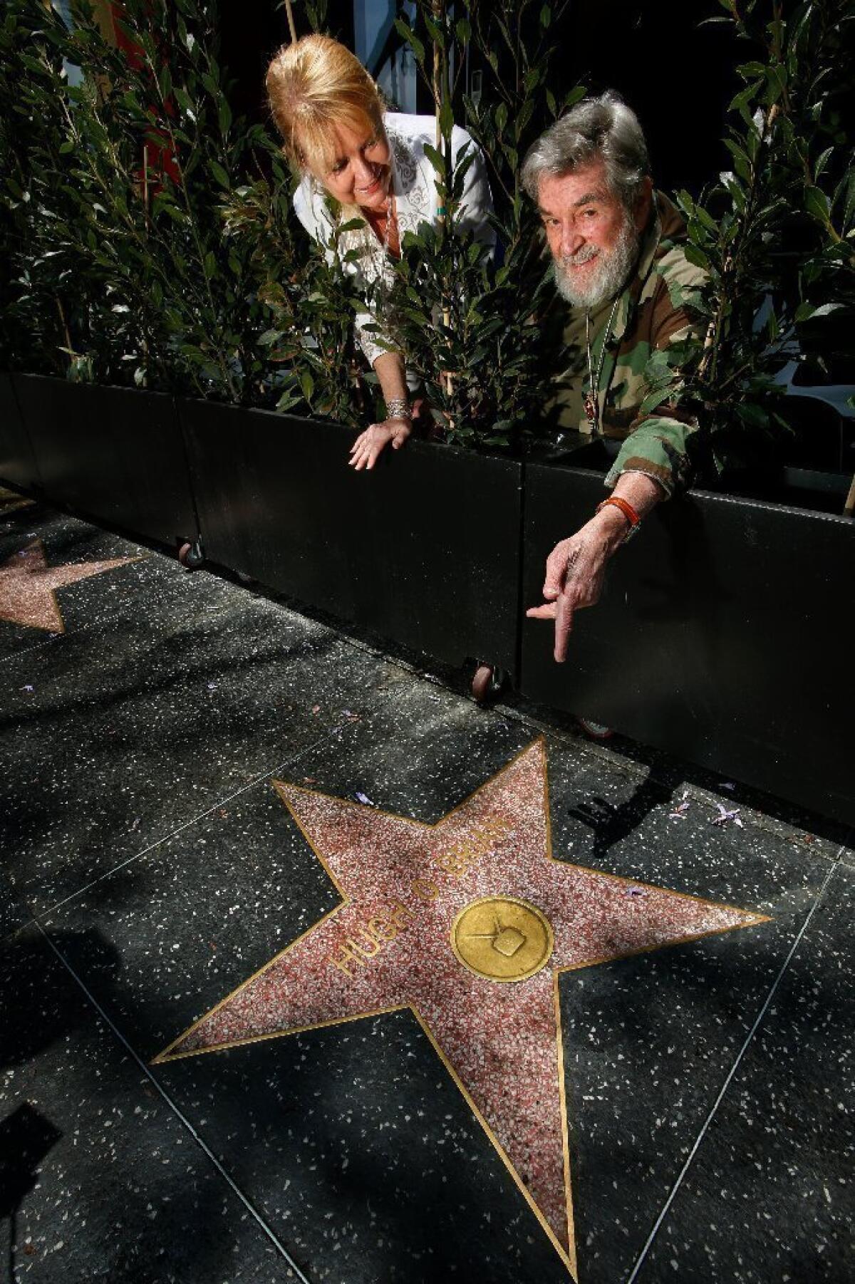 Actor Hugh O'Brian and his wife, Virginia, next to his star on the Hollywood Walk of Fame.