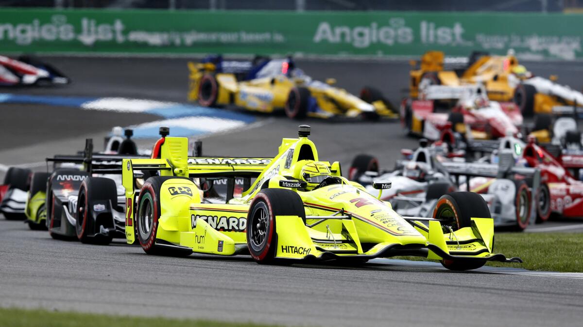 IndyCar driver Simon Pagenaud leads the field through the second turn at the start of the Grand Prix of Indianapolis on Saturday.