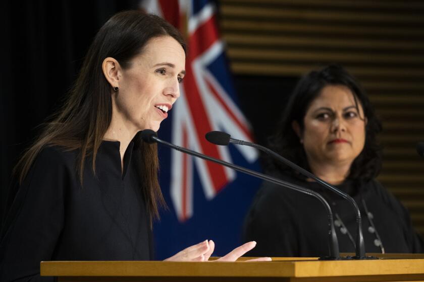 New Zealand Prime Minister Jacinda Ardern, left, gestures during the post-Cabinet press conference with Covid-19 Response Minister Ayesha Verrall, at Parliament, in Wellington, New Zealand, Monday, Sept. 12, 2022. Ardern said Monday that her government will not be pursuing any moves toward changing New Zealand to a republic following the death of Queen Elizabeth II. (Mark Mitchell/New Zealand Herald via AP)