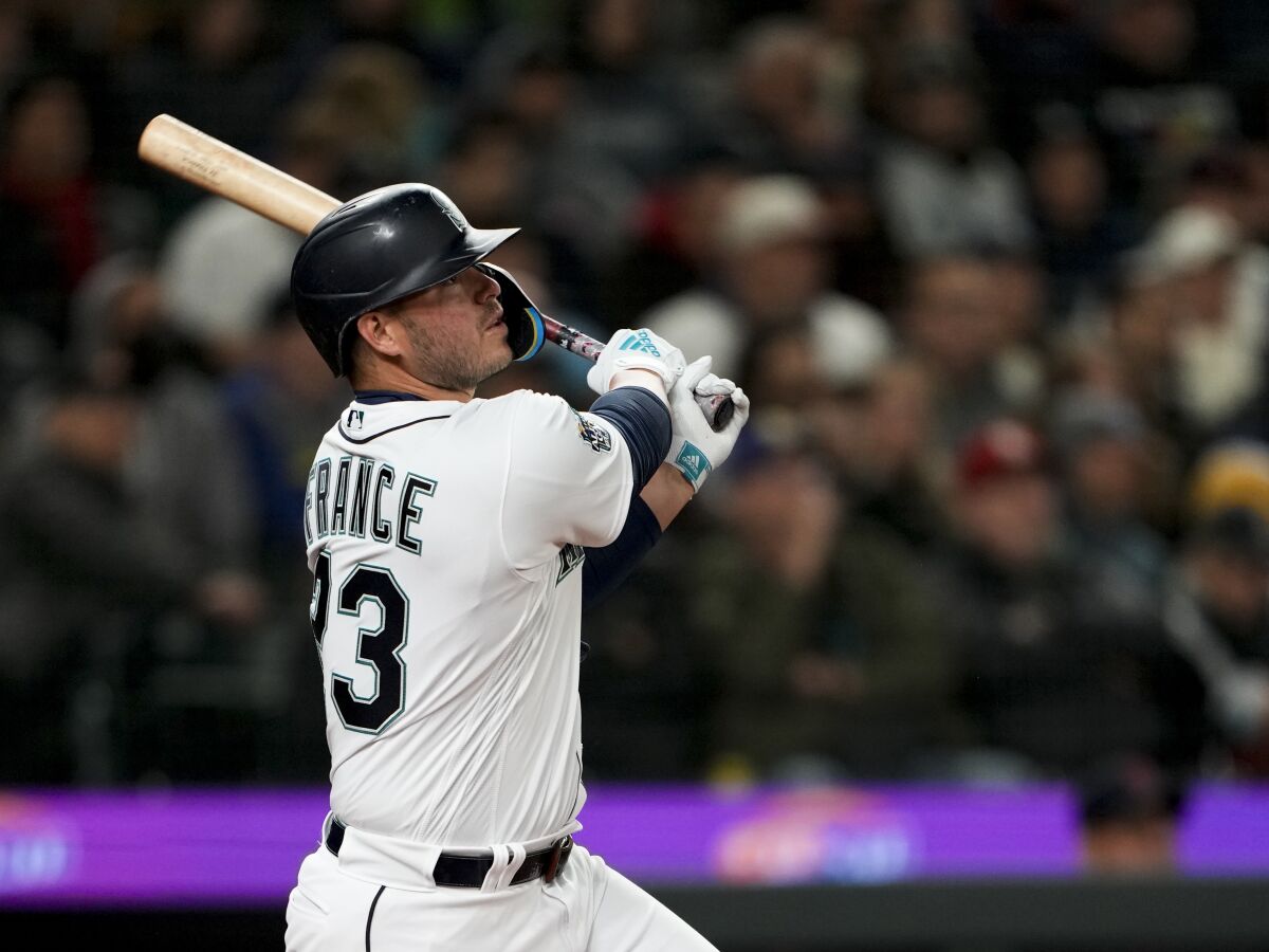 Seattle Mariners' Ty France watches his double to center field against the Cleveland Guardians during the sixth inning during an opening day baseball game Thursday, March 30, 2023, in Seattle. (AP Photo/Lindsey Wasson)