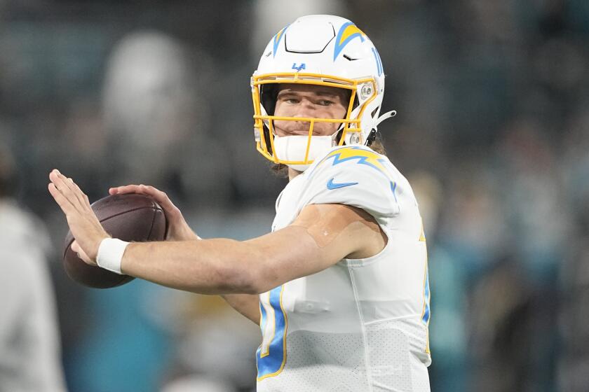 Los Angeles Chargers quarterback Justin Herbert (10) readies to throw.