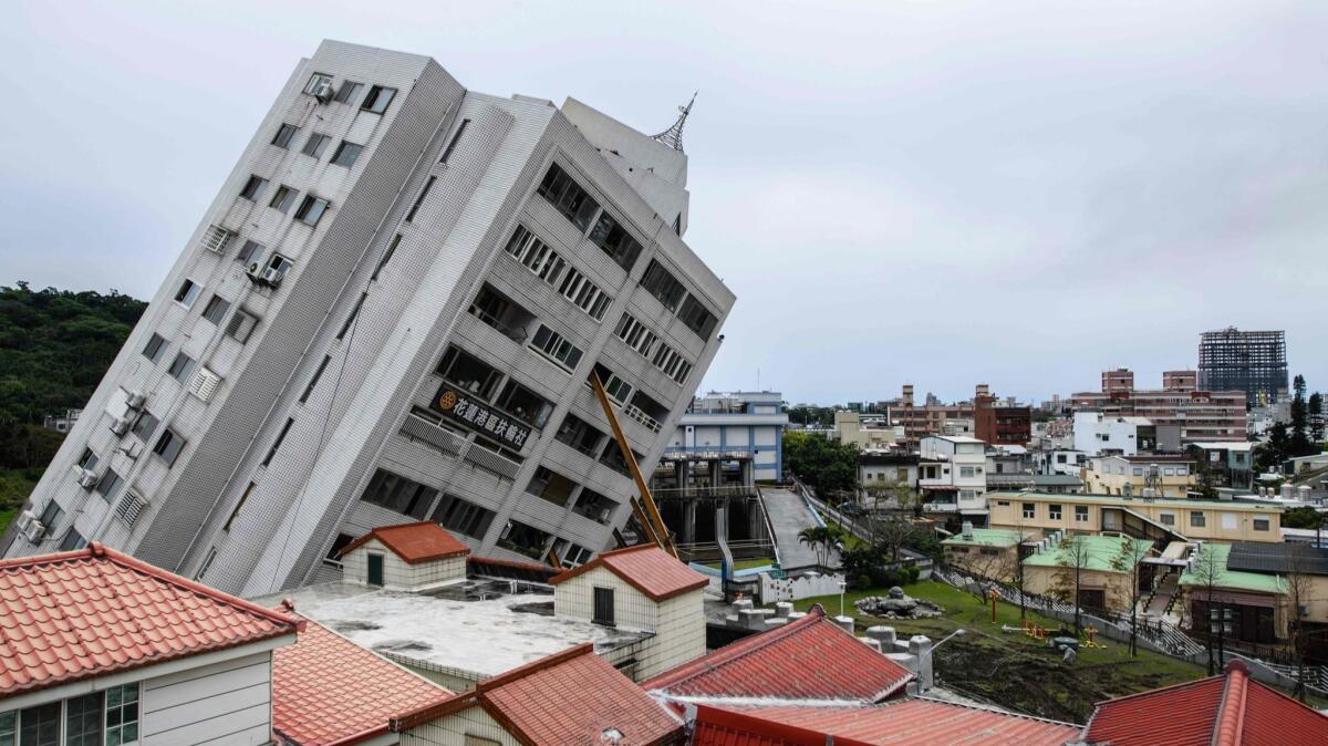 The 12-story Yun Tsui building leans precariously after partially collapsing when a magnitude 6.4 earthquake struck the Taiwanese city of Hualien on Feb. 6. The capital, Taipei, had 11 seconds of warning broadcast on television before the shaking started.