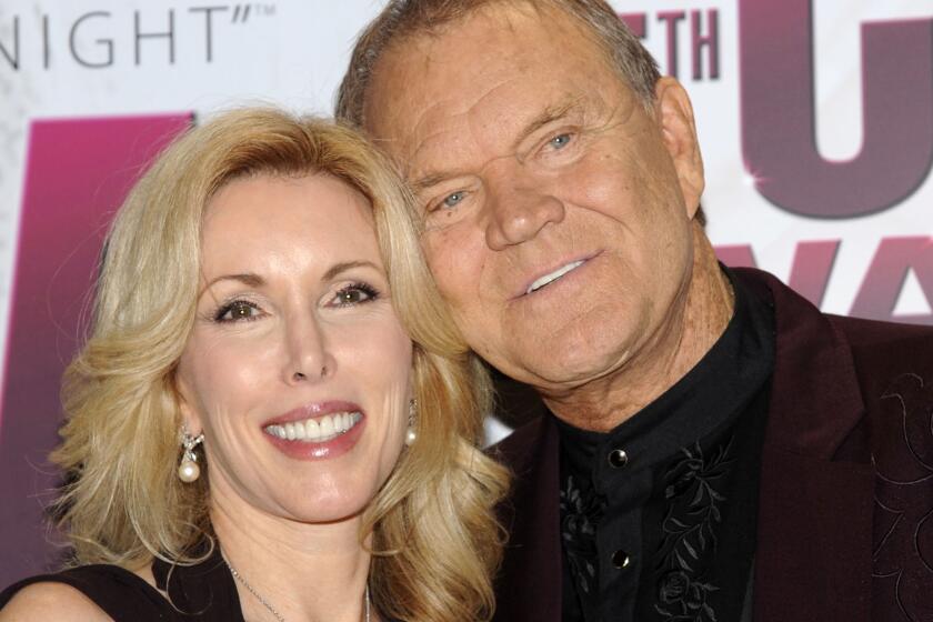 Singer Glen Campbell and his wife, Kim, at the CMA Awards in late 2011, several months after his Alzheimer's diagnosis was revealed.