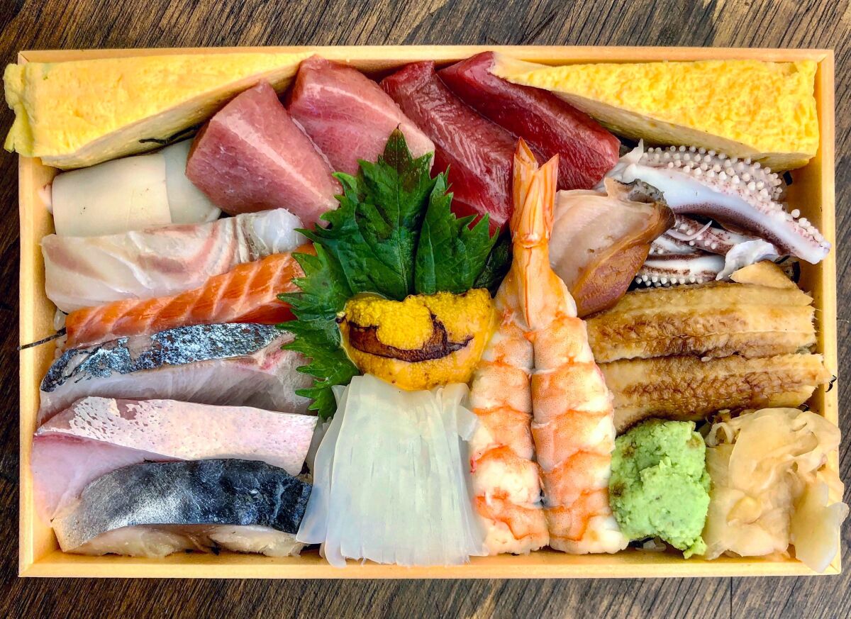A box of chirashi from Sushi ii.