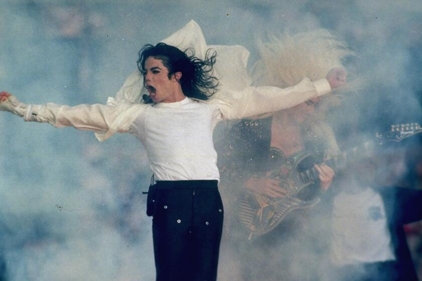 FILE - In this Jan. 31, 1993, file photo, Michael Jackson performs during the halftime show at the Super Bowl XXVII in Pasadena, Calif. Jackson’s estate and IMAX are partnering to digitally remaster “Michael Jackson’s Thriller 3D” into IMAX 3D. The partnership was announced Wednesday, Aug. 29, 2018, which would have been the singer’s 60th birthday. It will be released in IMAX theaters across the U.S. for one week beginning on Sept. 21. (AP Photo/Rusty Kennedy, File)