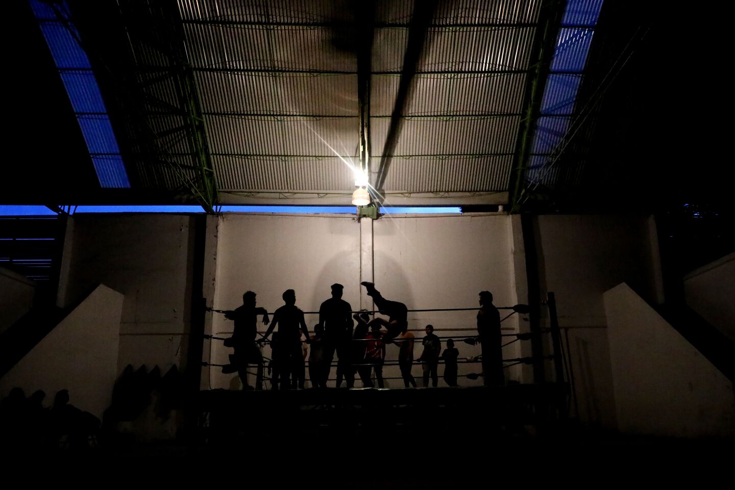 Wrestlers from the Escuela de Lucha Libre de Promociones Corsario Negro train at the Centro Civico in Ecatepec, Mexico.