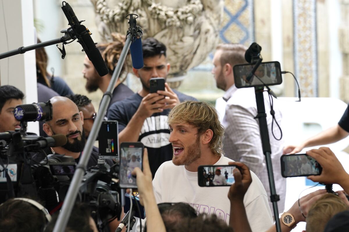 Logan Paul is interviewed during a media event.