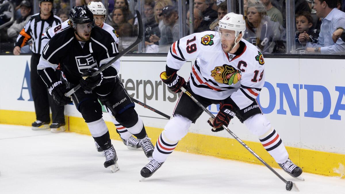 Chicago Blackhawks captain Jonathan Toews, right, controls the puck ahead of Kings center Anze Kopitar during the Kings' win in Game 3 of the Western Conference finals on Saturday. Will Toews and the Blackhawks turn things around in Game 4?