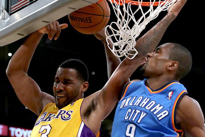 Shawne Williams has been named NBA D-League performer of the week. Above, while playing last month with the Lakers, Williams has a shot blocked by the Thunder's Serge Ibaka.