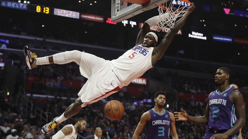 Clippers center Montrezl Harrell dunks against Charlotte on Tuesday night.