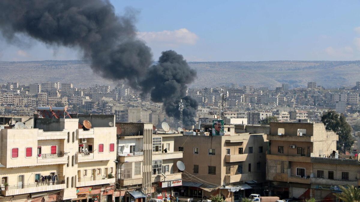 Smoke billows from the northern Syrian Kurdish town of Afrin on Jan. 31.