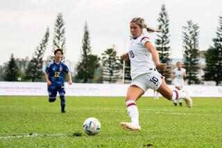 Emily Spreeman, a player on the U.S. women's national deaf soccer team, controls the ball during a game.