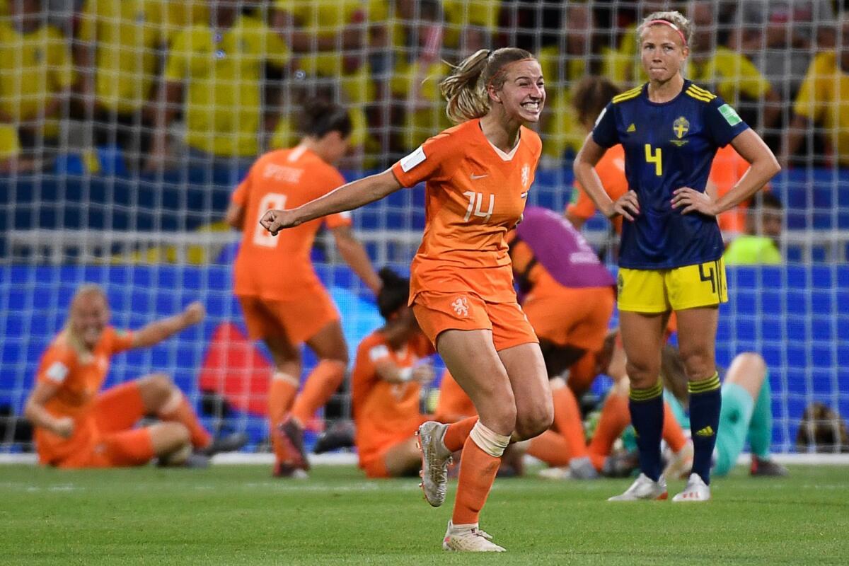 Midfielder Jackie Groenen, center, celebrates after the Netherlands defeated Sweden in a Women’s World Cup semifinal match in Lyon, France. Groenen scored the only goal of the game.