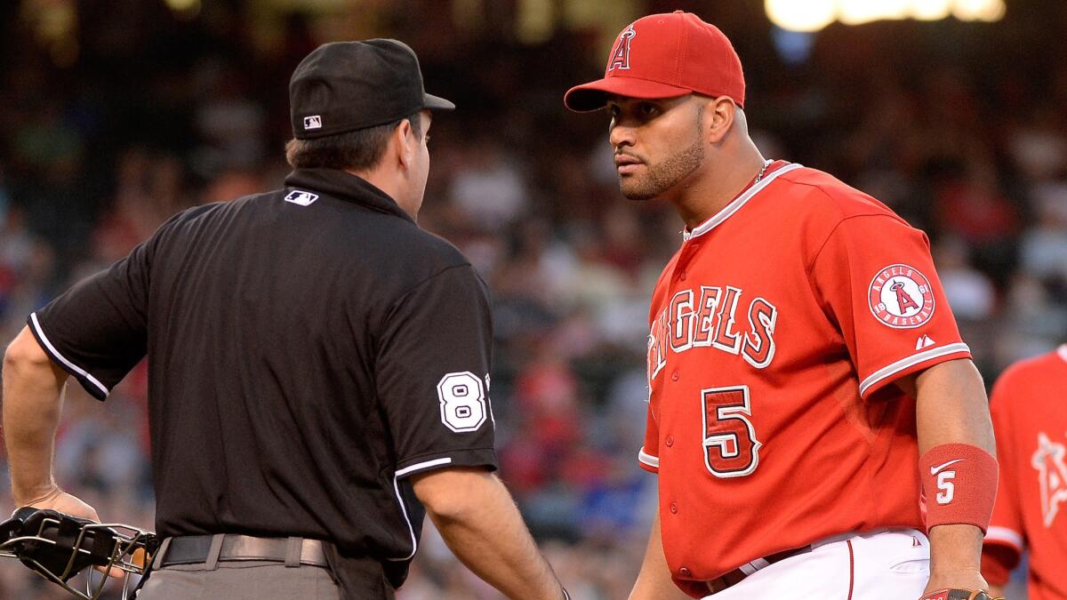 Angels first baseman Albert Pujols reacts to a call made by home plate umpire David Rackley during the third inning of the team's 4-0 loss to the Toronto Blue Jays on Tuesday night.