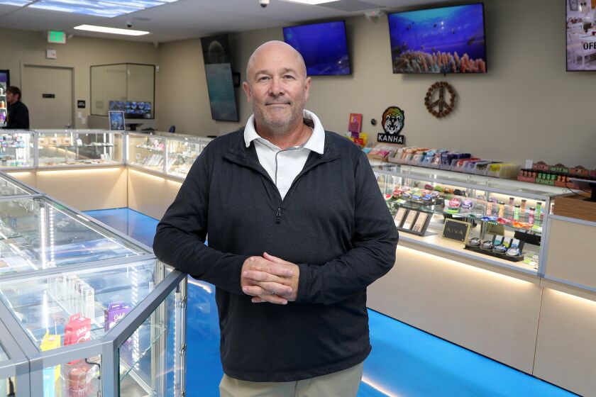 Owner Robert Taft stands inside his newly opened 420 Central Newport Mesa store on Wednesday in Costa Mesa. (Kevin Chang / Daily Pilot)
