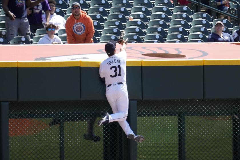 Detroit Tigers outfielder Riley Greene (31) cannot catch a Texas Rangers' Marcus Semien home run in the first inning of a baseball game, Thursday, April 18, 2024, in Detroit. (AP Photo/Paul Sancya)