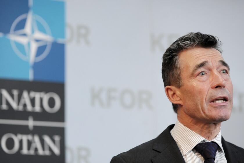 NATO Secretary-General Anders Fogh Rasmussen addresses journalists in Pristina, Kosovo, on July 3.