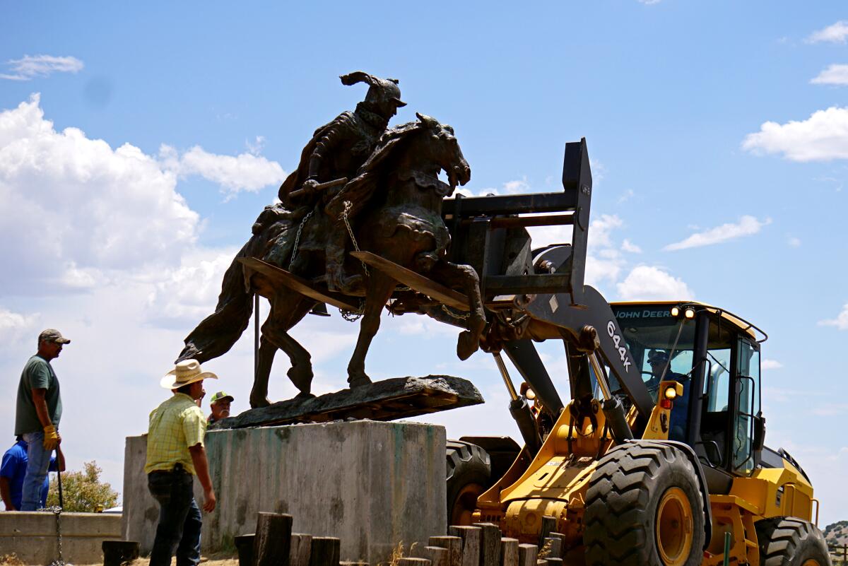 The removal of a statue of  Juan de Oñate from a pedestal at the Oñate Monument and Resource Center in Alcalde, N.M. 