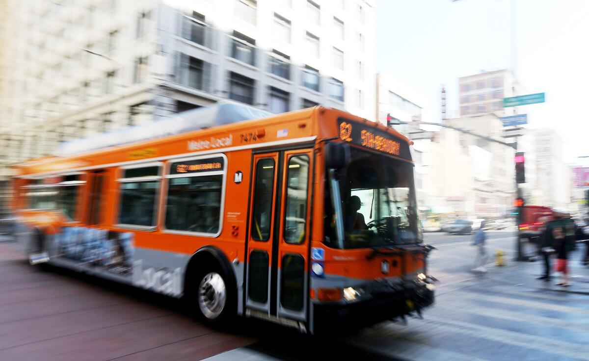An L.A. Metro bus drives down Third Street in downtown Los Angeles.