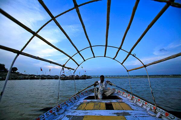 A boatman rows on the River Ganges in Allahabad, India.