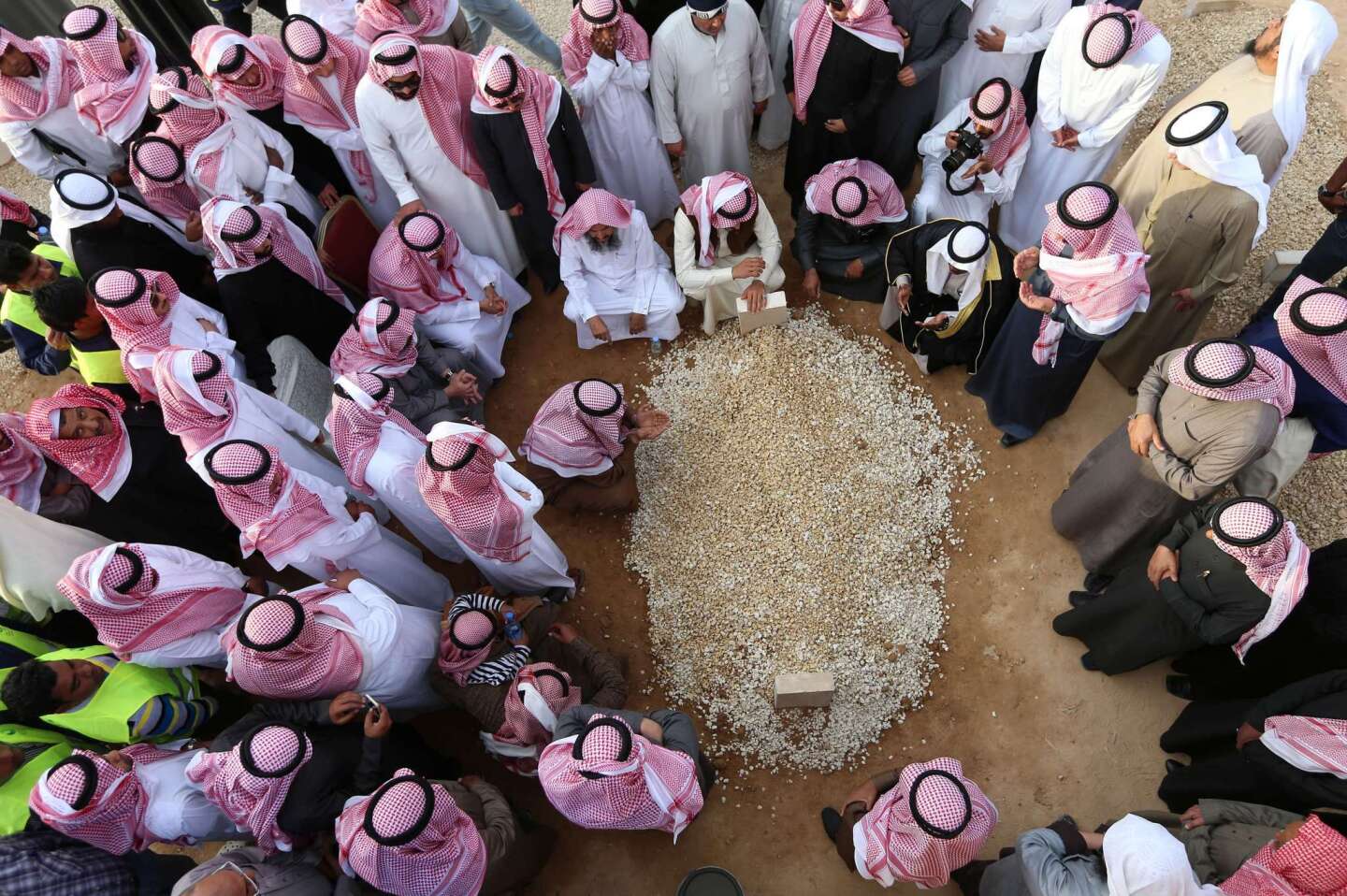 Mourners gather around the grave of Saudi Arabia's King Abdullah at Al Oud cemetery in Riyadh on Jan. 23 following his death in the early hours of the morning.