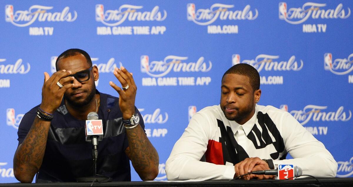 Miami Heat stars LeBron James and Dwyane Wade answer questions from the media after losing in the NBA Finals to the Spurs.