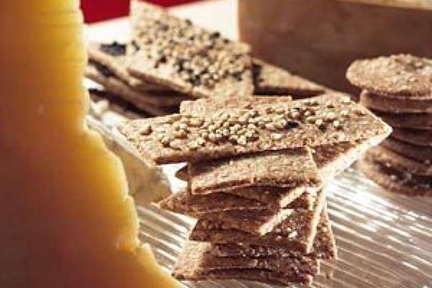 Just add cheese: Homemade four-seed snapper crackers, center, and wheat crackers go well with appetizers.