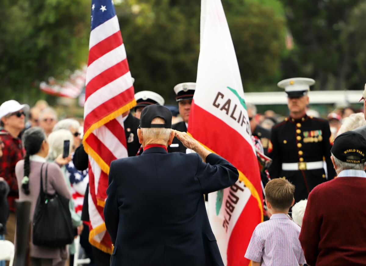 Guests stand and salute at the Annual Memorial Day Ceremony at Harbor Lawn-Mt.Olive Memorial Park in Costa Mesa in 2023.