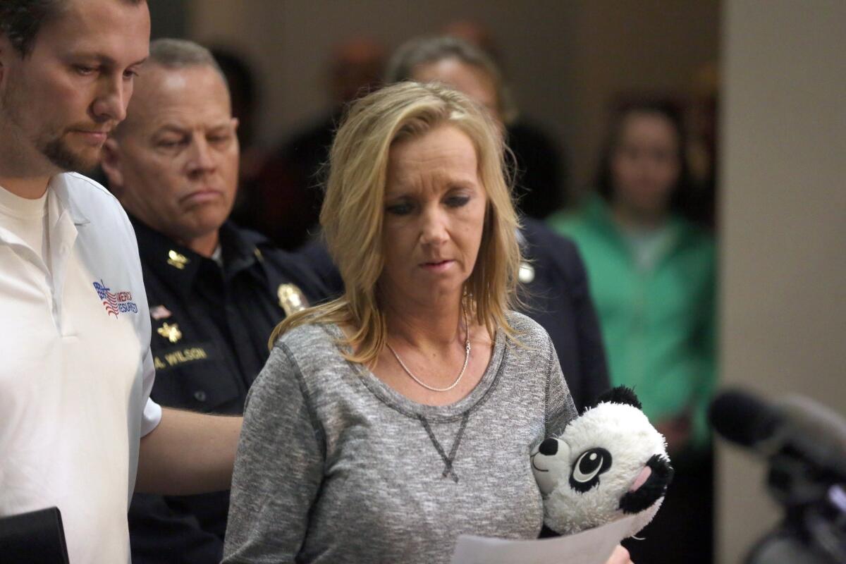 Tammy Weeks, mother of slain teenager Nicole Madison Lovell, moves towards the podium to speak about her daughter at a news conference Feb. 2 in in Blacksburg, Va.
