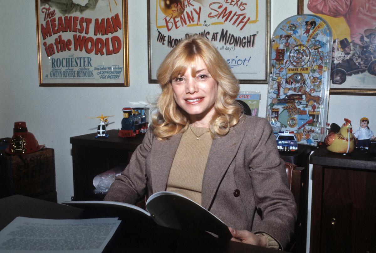 Phyllis Golden-Gottlieb sitting at a desk