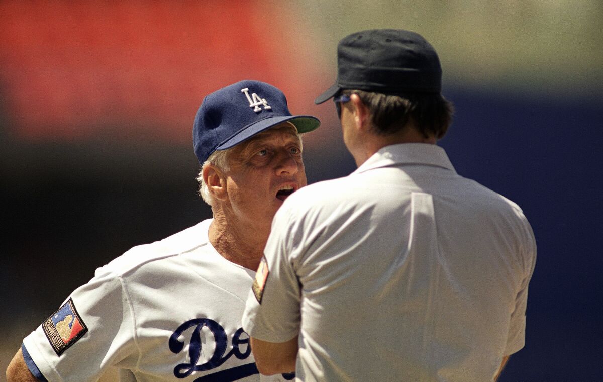 Tommy Lasorda argues a call with first base umpire Bill John in 1994.