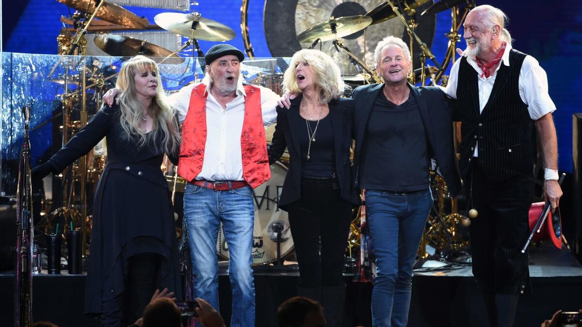 Fleetwood Mac's Stevie Nicks, from left, John McVie, Christine McVie, Lindsey Buckingham and Mick Fleetwood at Friday's MusiCares Person of the Year benefit in New York.