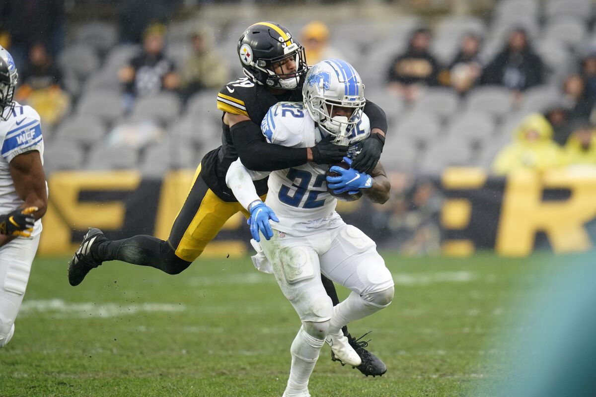 Detroit Lions running back D'Andre Swift (32) is tackled by Pittsburgh Steelers free safety Minkah Fitzpatrick (39) during the second half of an NFL football game, Sunday, Nov. 14, 2021, in Pittsburgh. (AP Photo/Keith Srakocic)