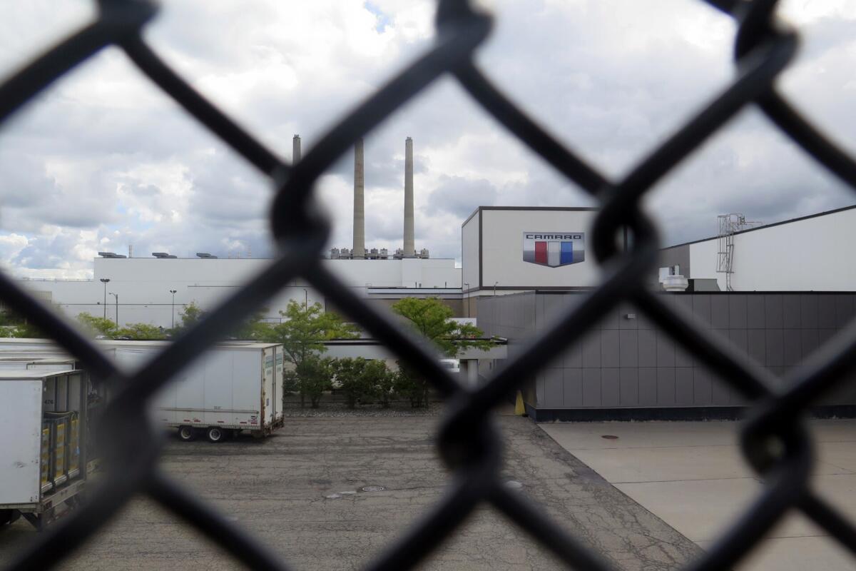 General Motor's Lansing Grand River Assembly plant is seen behind a fence in Lansing, Mich.