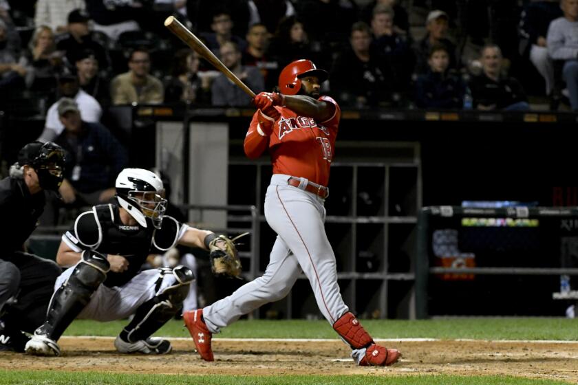 Los Angeles Angels' Brian Goodwin (18) hits a two-run home run off Chicago White Sox's Aaron Bummer during the eighth inning of a baseball game Friday, Sept. 6, 2019, in Chicago. (AP Photo/Matt Marton)