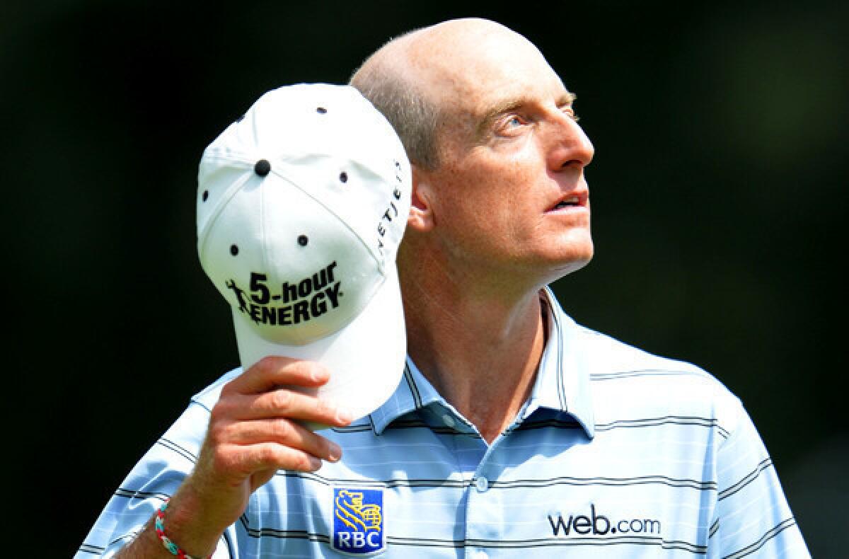 Jim Furyk's early round of 65 held up for a share of the lead with Adam Scott on Thursday during the first round of the PGA Championship at Oak Hill Country Club in Rochester, N.Y.
