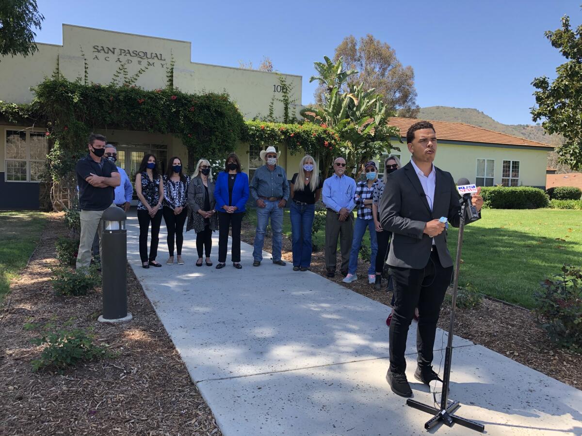 Supporters of San Pasqual Academy, a boarding school for foster children, met outside the school in Escondido on May 4. 