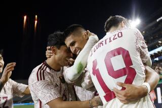 Guillermo Martinez of Mexico is congratulated by Omar Govea and Jordi Cortizo after scoring a goal against Colombia.