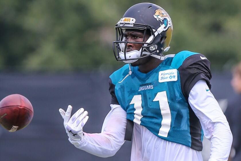 Jacksonville Jaguars wide receiver Marqise Lee tosses the ball during a team practice session in July.