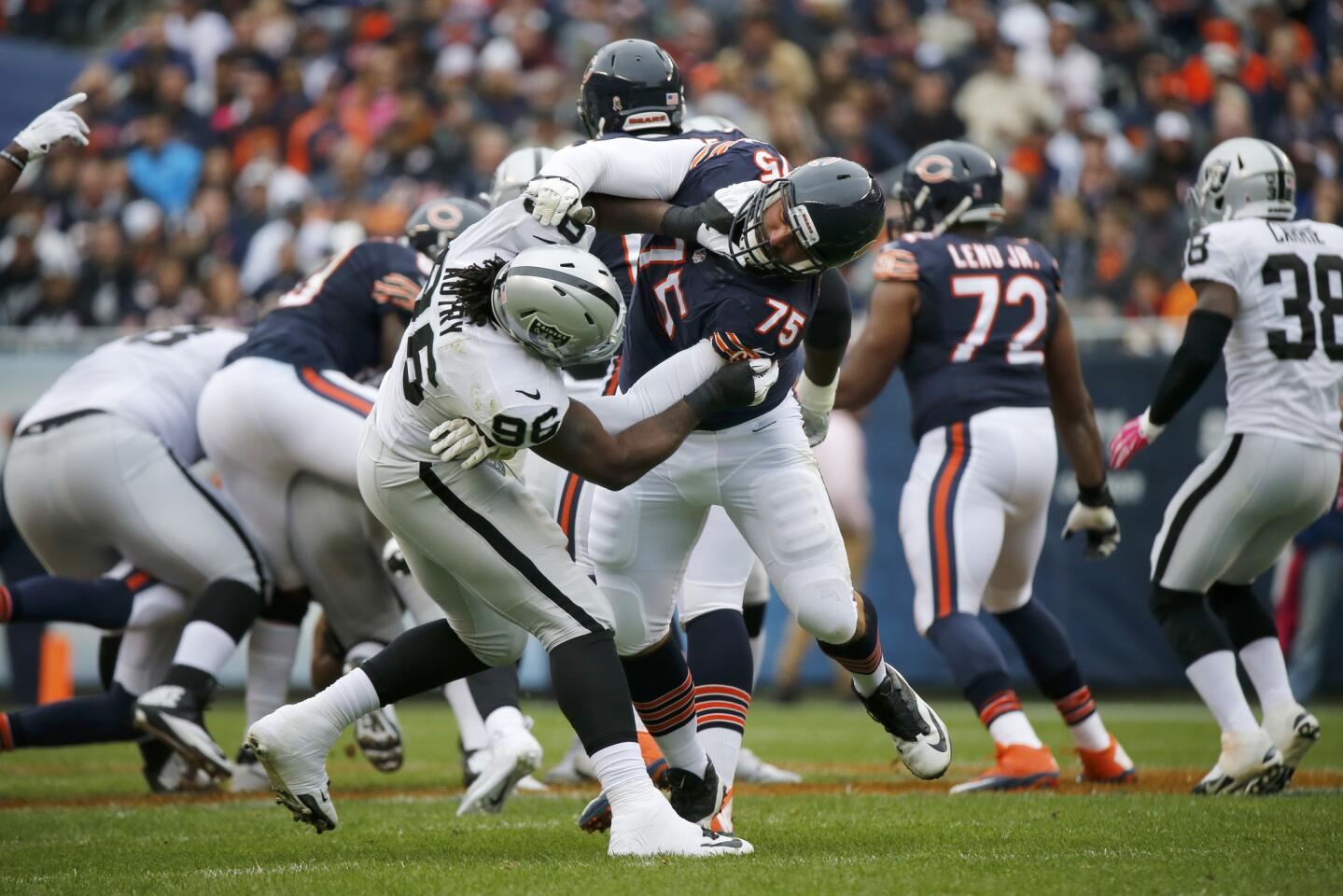 Kyle Long battles with Raiders defensive end Denico Autry at Soldier Field on Oct. 4, 2015.