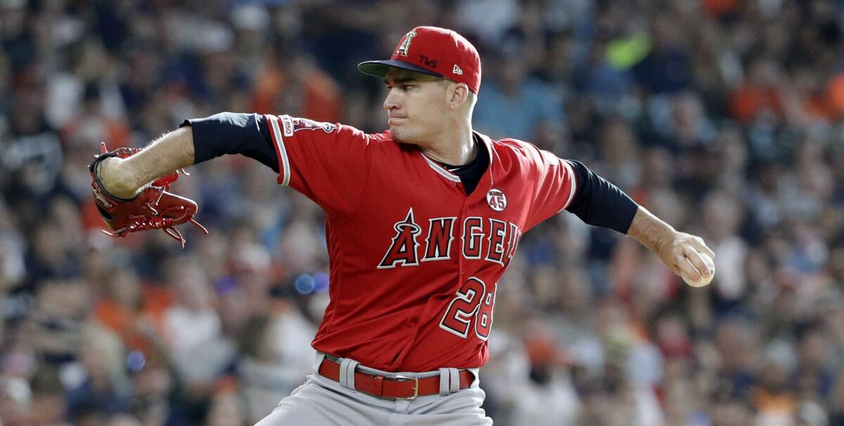 Angels starting pitcher Andrew Heaney throws against the Houston Astros on July 6.