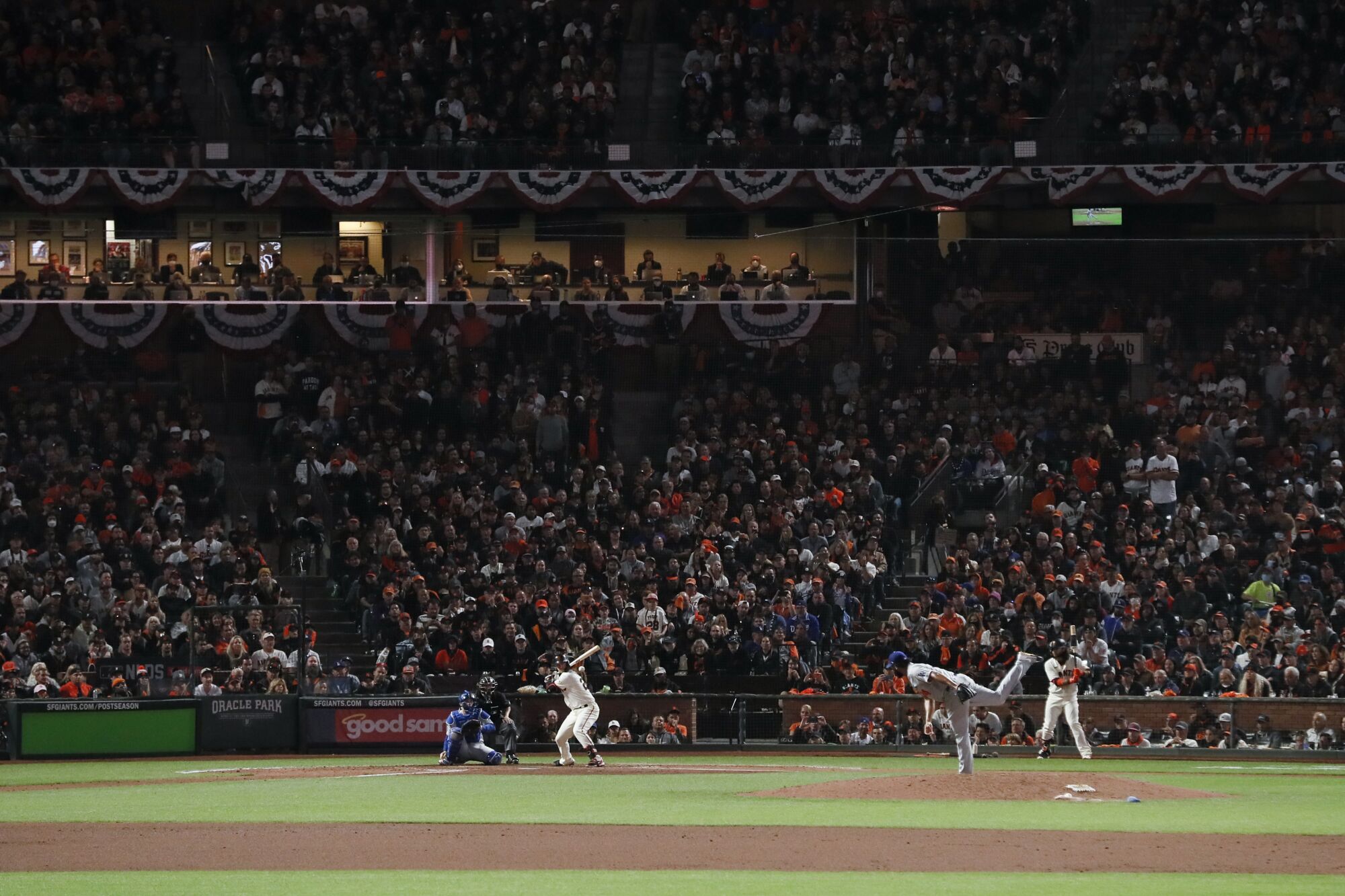 Los Angeles Dodgers relief pitcher Kenley Jansen, right, pitches to San Francisco Giants' Buster Posey