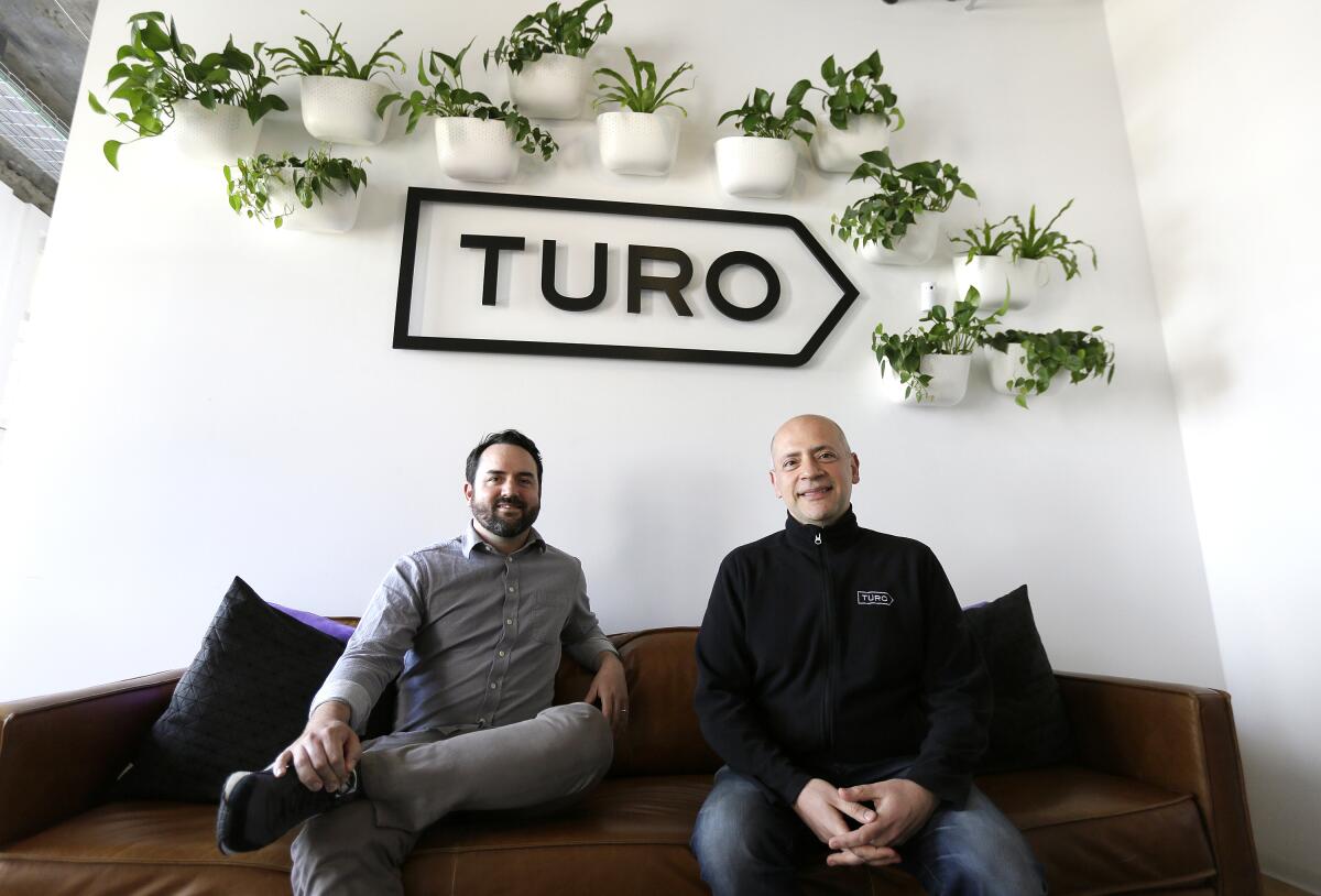 Andre Haddad, right, is chief executive of Turo; Steve Webb is vice president of communications.