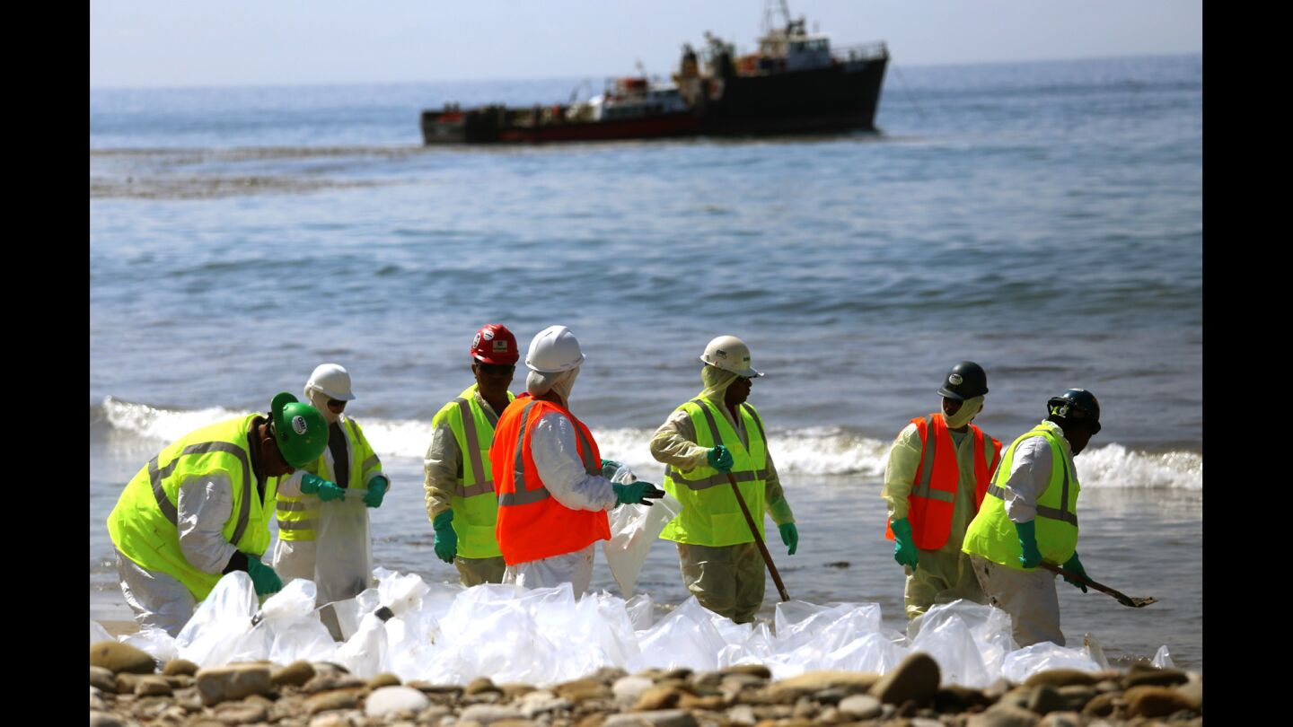 Patriot Environmental Services workers continue May 27 to clean the shoreline at Refugio State Beach in Goleta. On May 19, a privately owned crude oil pipeline ruptured, causing an oil spill within and around Refugio State Beach. Santa Barbara County beaches affected by the spill are expected to remain closed until June 4.