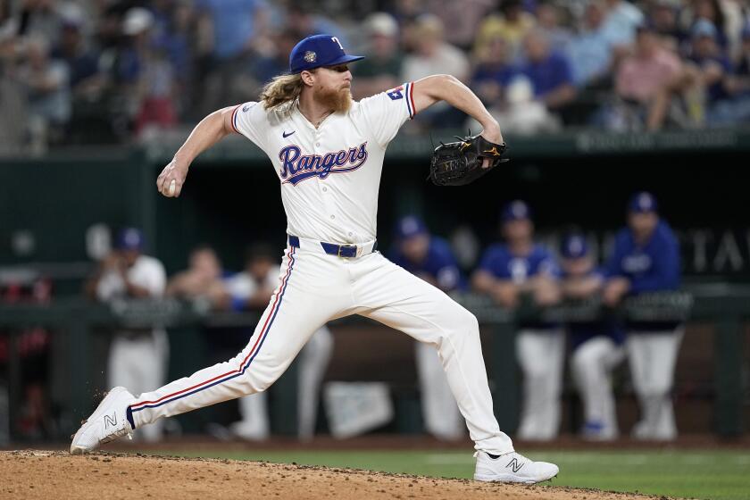 Texas Rangers starting pitcher Jon Gray throws to the Washington Nationals in the seventh inning of a baseball game in Arlington, Texas, Tuesday, April 30, 2024. (AP Photo/Tony Gutierrez)