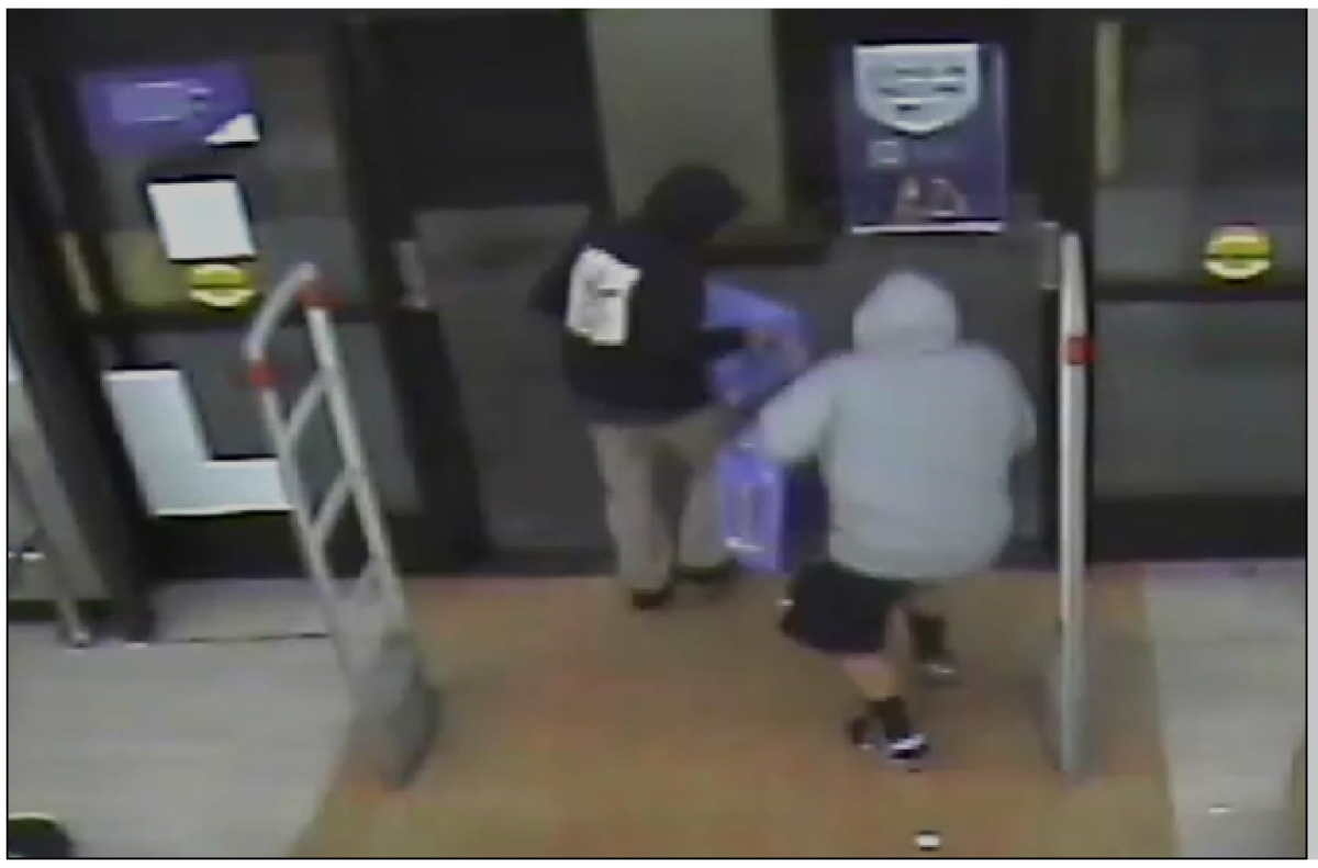 A video image of two suspects in the killing of a Rite Aid employee.